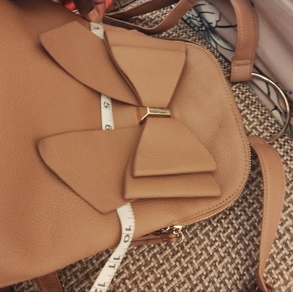 Crossi women's tan bow mini back pack w/ adjustable straps and interior pockets - Picture 11 of 12